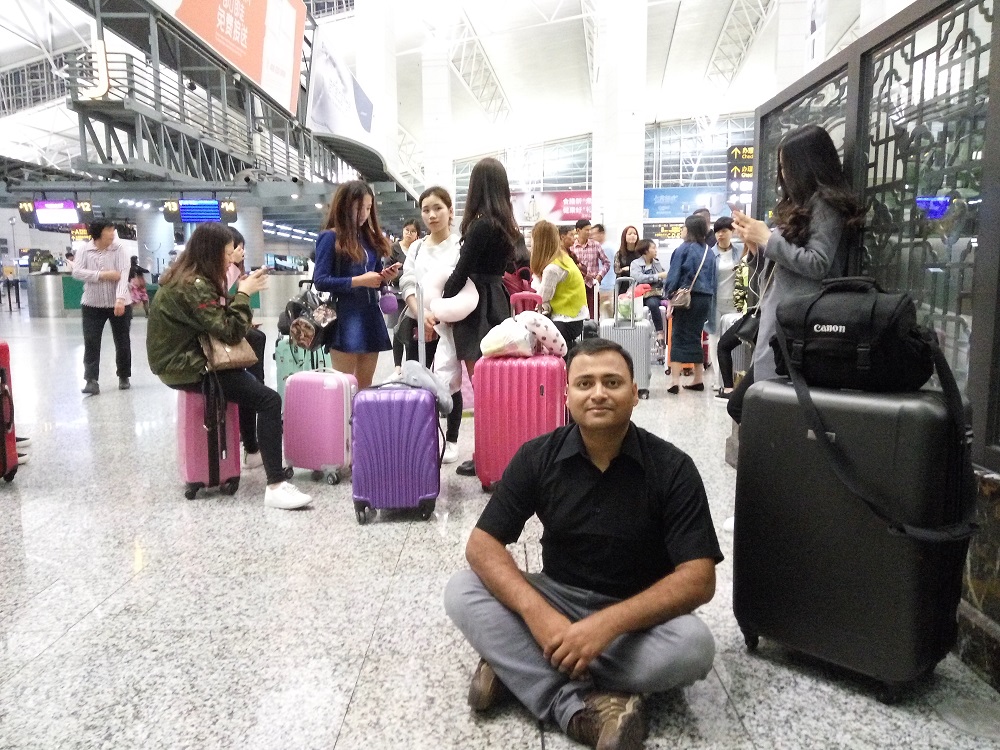 Too few Chairs- we had to sit-down on the ground. The numbers of chairs at the Guangzhou International Airport has been just not sufficient enough. :(