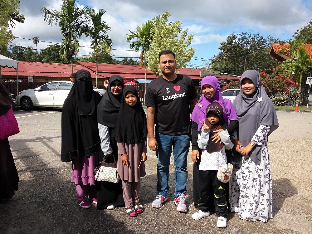Just outside the Mahsuri's Tomb (Makam Mahsuri), Langkawi, Malaysia – they wanted a photo with me as much as I wanted with them. I was in fact a bit shy, which they realised and were smiling at me. “Why so shy?” - One of them asked me and suggested to not be shy. Well, travel is also about accepting and respecting the cultural diversity.