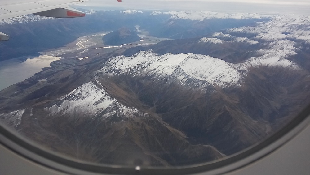 Snowy mountains while landing at Queenstown Airport.