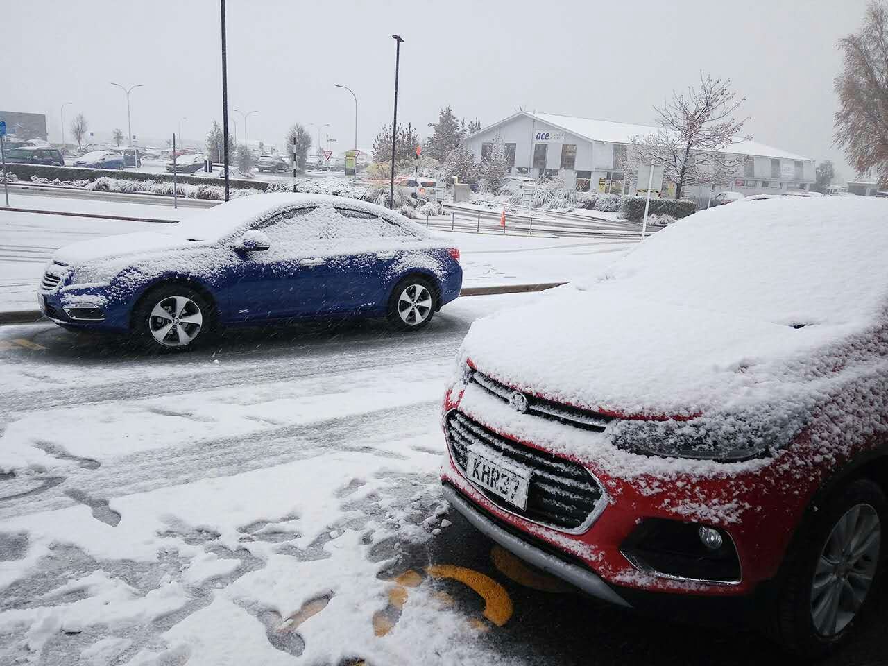 Cars covered with snow just outside the Queenstown International Airport – the Queenstown ski season had just begun!