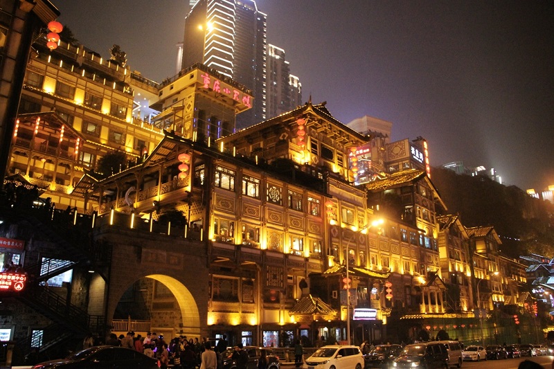 Hongyadong (洪崖洞) or Hongya Cave is the best place to find authentic local food in Chongqing. You’d love the Chongqing’s night view.