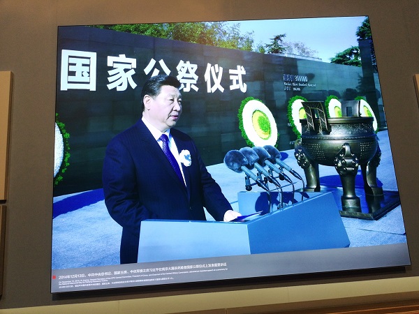 Chinese president Xi Jin Ping addressing the nation from the Nanjing Massacre Memorial Hall museum.