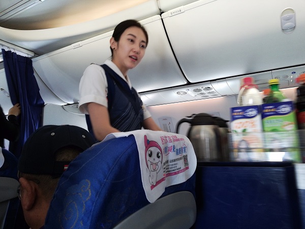 Air Hostess - Shandong Airlines crew member.