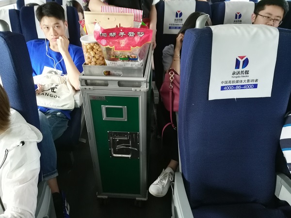 Catering service - food trolley in China’s fast bullet train. Pay and eat.