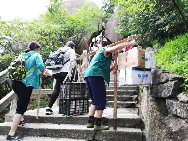 A tough life – the guy carried groceries to the hotels on top of Huangshan.