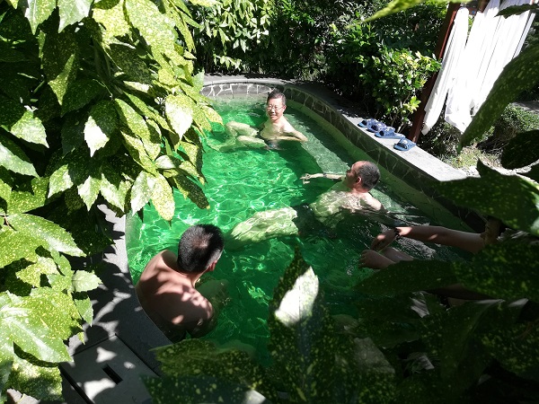 Seniors enjoying a green spring bath at Yellow Mountain, China.