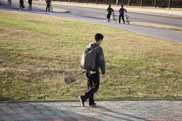 A local on his way to work in Pyongyang city. 