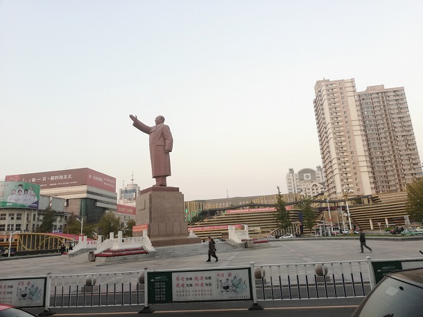 Statue of Chairman Mao Zedong, outside Dandong Railway Station. 