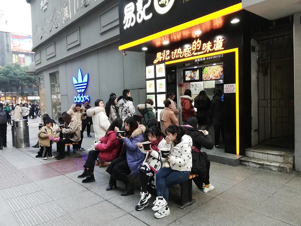 The locals enjoying dry noodles in Wuhan city. 